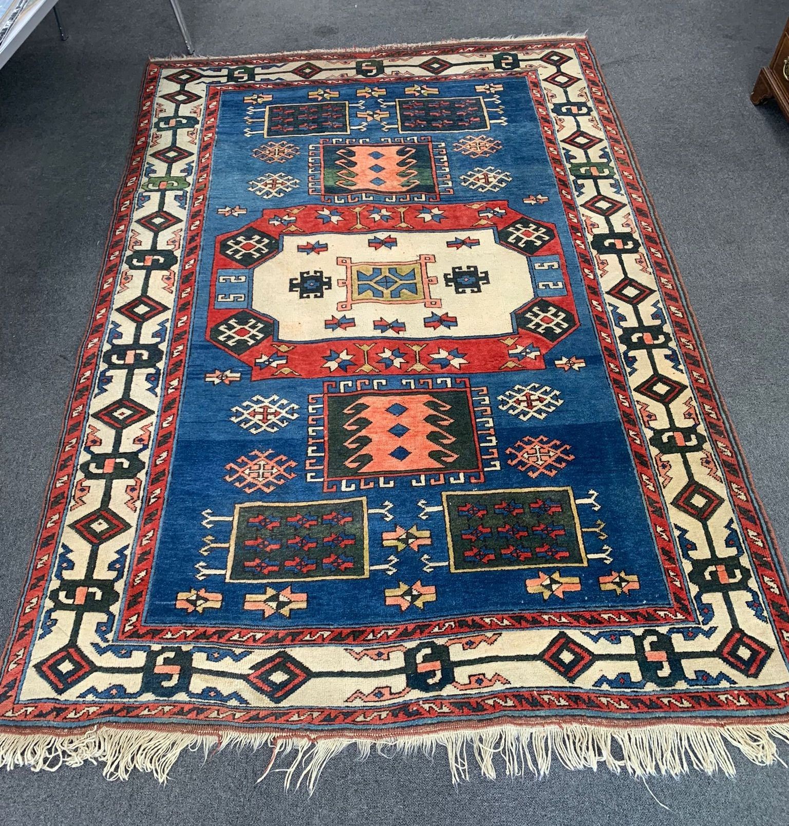 A Caucasian style blue ground carpet, 250 x 180cm